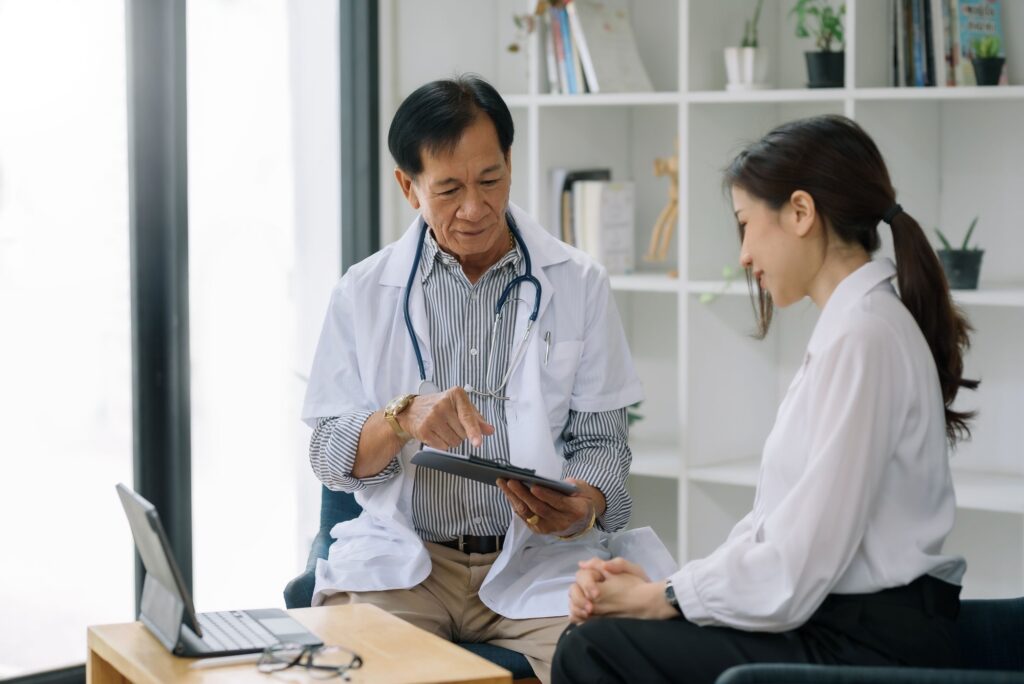 Provider pointing and speaking with patient.