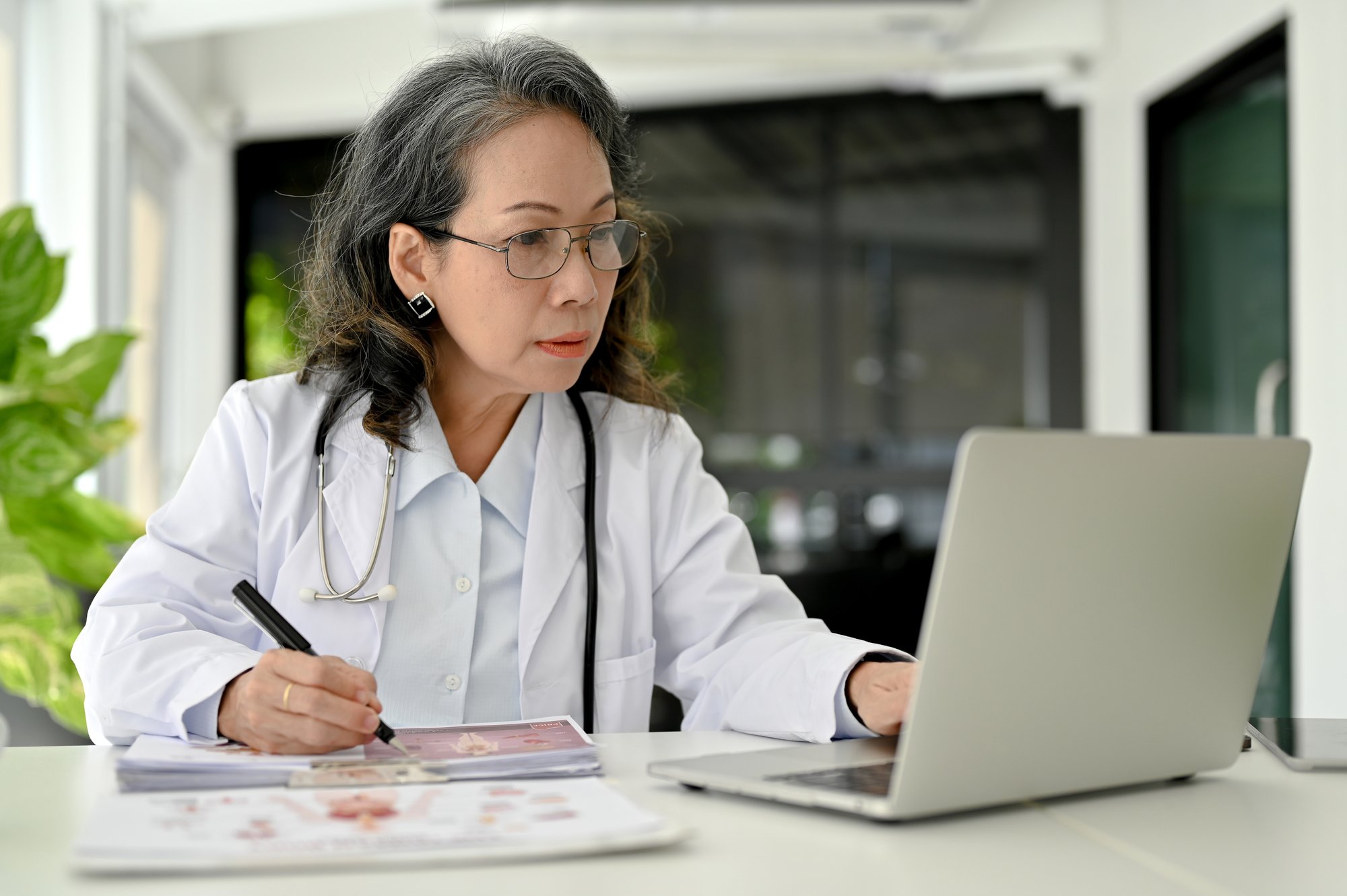 Provider working on a laptop.